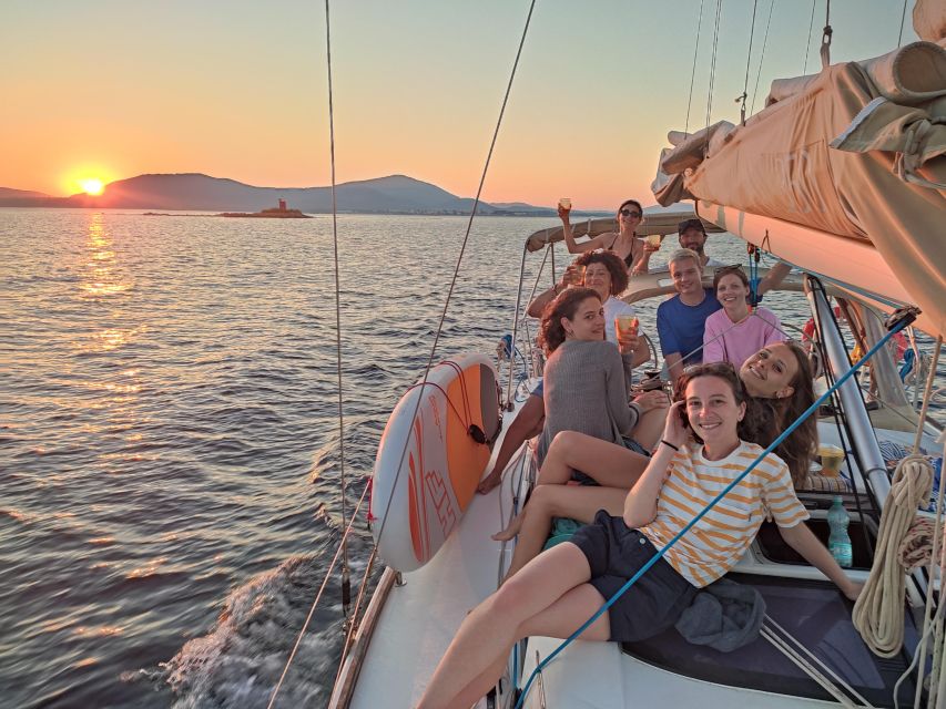 Alghero: Sunset Sailing Aperitif Experience - Aperitivo onboard: free drinks, real snacks, and music that keeps the mood up