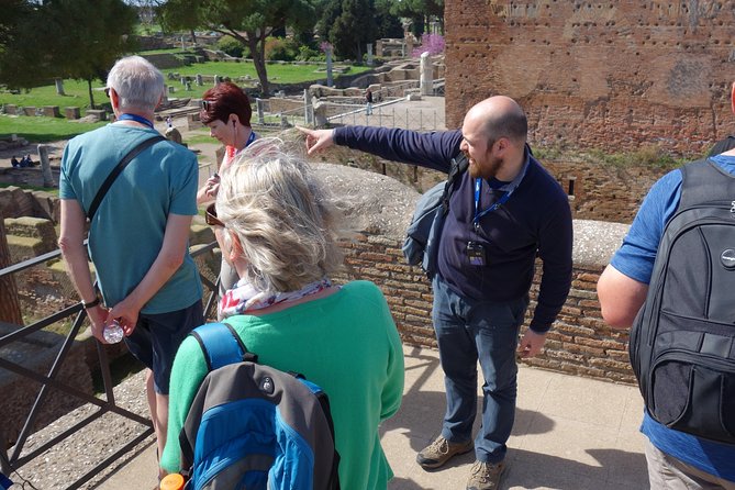 Ancient Ostia Antica Semi-Private Day Trip from Rome by Train with Guide - Baths of Neptune Mosaic and the Amphitheater: The Big-Deal Stops