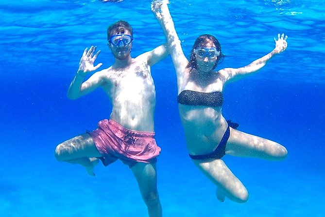 Boat Tour Egadi Day discover Favignana and Levanzo from Trapani - Favignana port break at the Florio tonnara site
