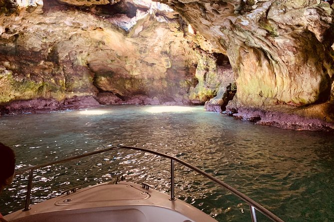 Boat tour of the Polignano a Mare caves with aperitif - Cala Paura: The Rock Writing Torno Subito