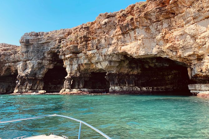 Boat tour of the Polignano a Mare caves with aperitif - Grotta Azzurra: Why the Water Turns Blue
