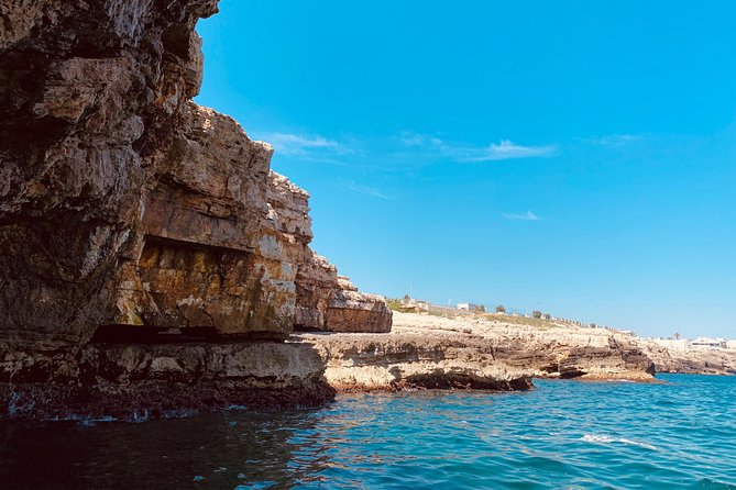 Boat tour of the Polignano a Mare caves with aperitif - Lama Monachile: The Postcard Beach From a Sea Angle