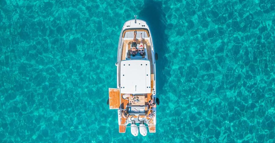Cagliari: Luxury Motorboat Tour with 3 Swim Stops & Wine - Sailing out of Marina Piccola, and what the small-group pace feels like