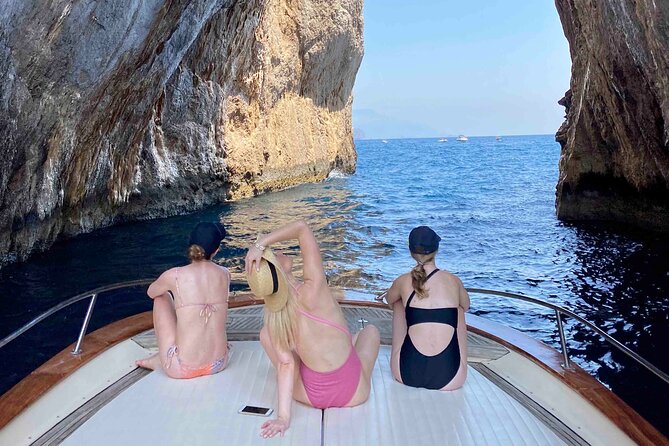 Capri Boat Tour with Optional Blue Grotto Visit from Sorrento - White Grotta and the coastline story before you land on Capri