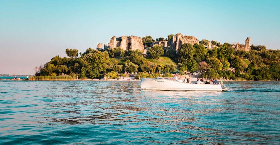Desenzano del Garda: Sunset Boat Trip at Sunset with Drink - Desenzano Harbor and the second jetty meet-up