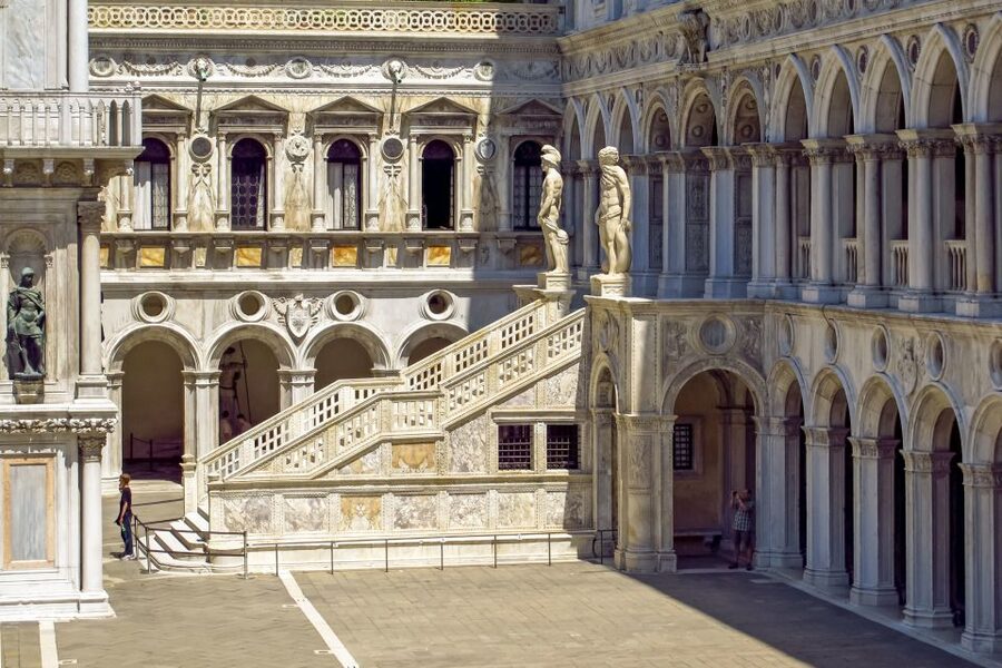 Doge's Palace Skip-the-Line Guided Tour - Atrium waiting room, statues, and the Bridge of Sighs from inside