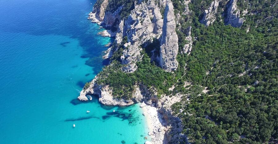 From Arbatax: Full-Day Guided Boat Tour of the Baunei Coast - Pools of Venus: the scenic photo and swim reset