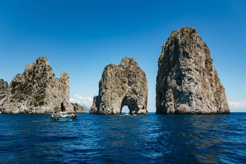 From Sorrento: Capri Boat Tour with Blue Grotto Visit - Capri by boat: Faraglioni, Punta Carena, and grottos from the water