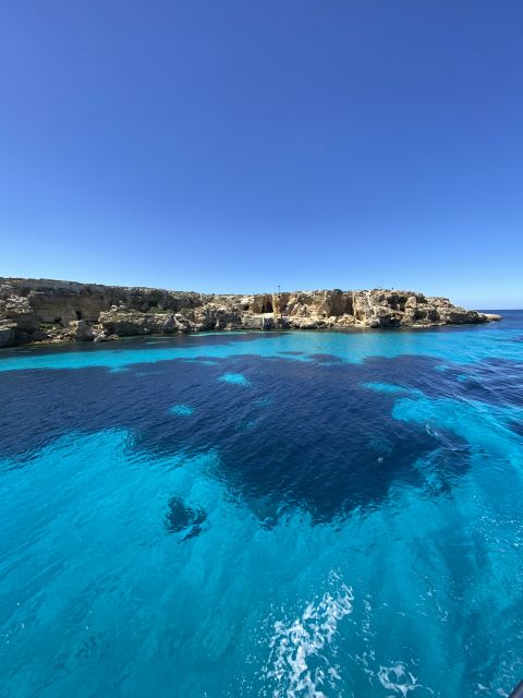 From Trapani: Favignana and Levanzo Mini Cruise with Lunch - Levanzo’s small village and the Faraglione sea stack