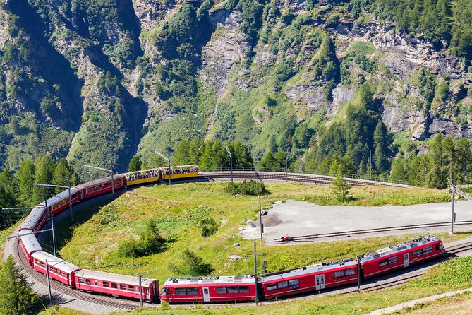 Intimate Small-Group Bernina UNESCO Scenic Train on Swiss Alps - Tirano Lunch Window and the Stairs to the Bernina Station
