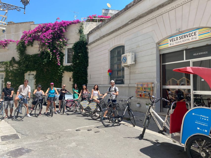 Lecce: City Highlights Guided Tour by Bike - Piazza SantOronzo and the Roman amphitheater remains