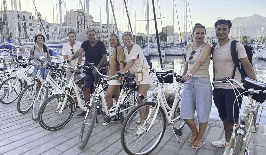 Palermo: Guided Bike Tour with Street Food Tasting - Radios, helmets, and pacing: how the guide makes it feel easy
