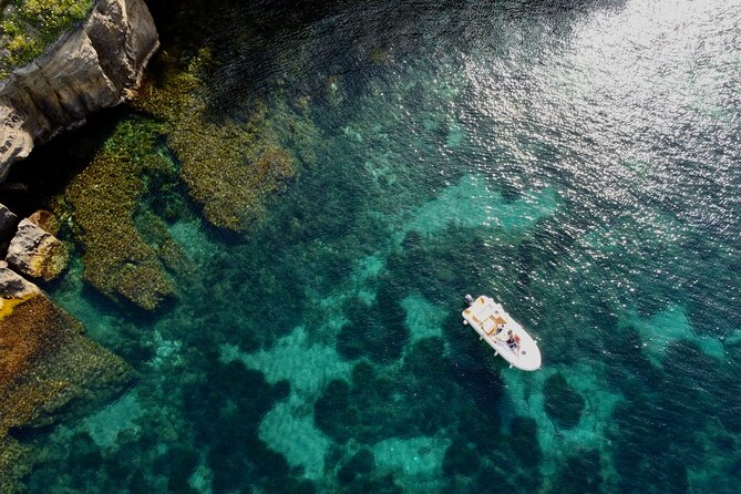 Procida Island Tour by Boat 2h 15m with Swimming and Underwater Photos - Stop 4: Cala del Pozzo Vecchio and the cinematic Postino beach