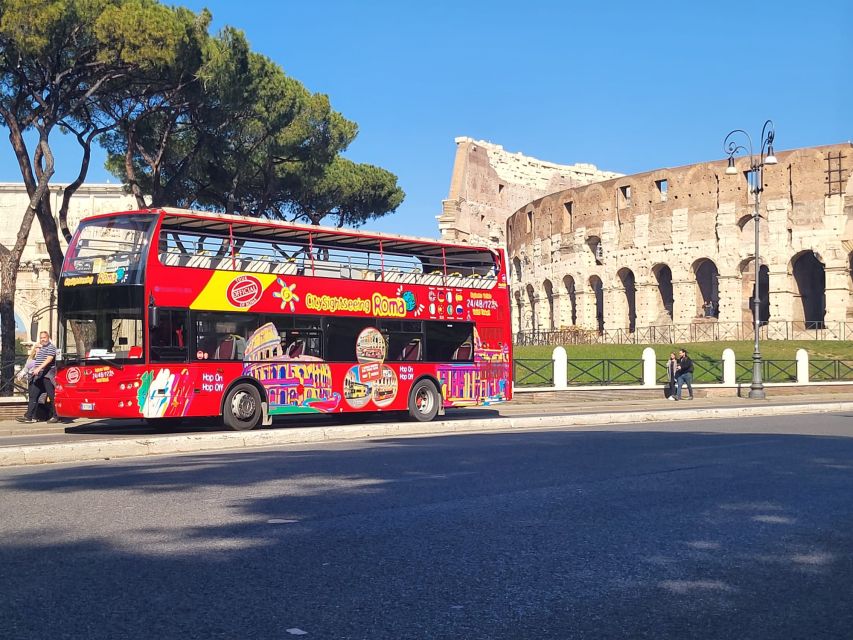 Rome: City Highlights Open-Top Bus Night Tour - Picking the best side of the bus for Colosseum photos