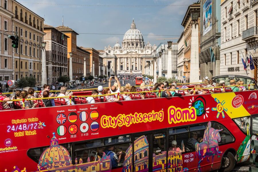 Rome: City Sightseeing Hop-on Hop-off Bus with Audioguide - Colosseum area: great for orientation, with one caution about stop access