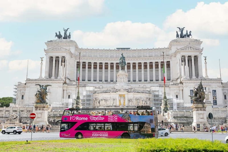 Rome: Hop-on Hop-off Sightseeing Bus Tour with Audioguide - Onboard Comfort: Headsets, Wi-Fi, and the Pink Bus Reality
