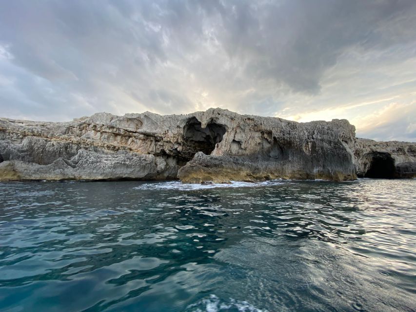 Syracuse: Boat Trip of Ortigia Island and Sea Caves - The big port, the Alfeo Promenade views, and the Ortigia canal pass-through