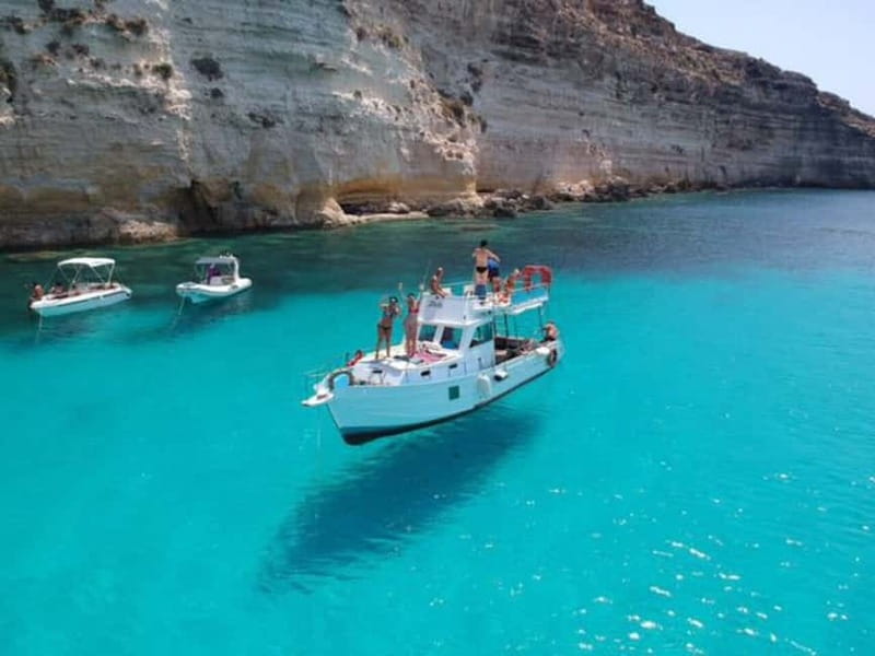 Taormina: Boat Tour with Aperitif on Isola Bella - Cruising the Taormina coast: dolphins, headlands, and the long bay feel