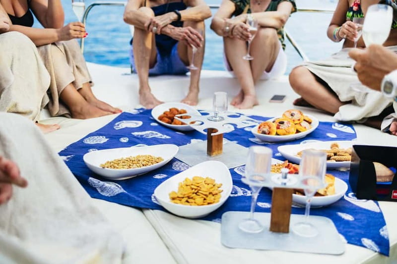 Taormina: Sunset Boat Tour with Dolphin Watching & Aperitif - The swim and snorkel stop at Isola Bella